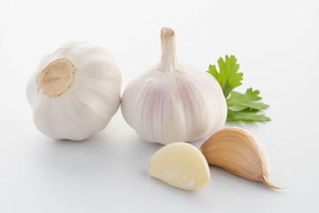 garlic with leaves of parsley isolated