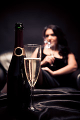 Young Woman Enjoying A Glass Of Champagne