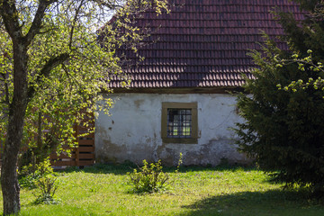 derelict barn at a cottage garden in rural countryside of south germany