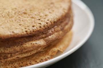homemade crepes on plate on slate board
