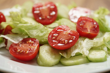 vegetable salad with tomato, cucumber and iceberg lettuce