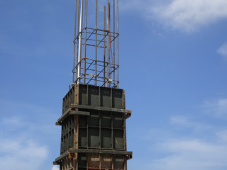 Reinforcement concrete column under construction at the construction site. Fabricated and constructed by workers.  