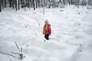 a boy in a knitted winter hat.