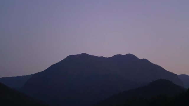 time lapse : mountain range day to night