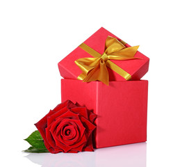 Classic gift box with golden satin bow and red rose