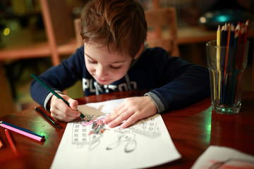 Kid drawing in cafe
