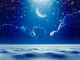 Crescent moon in dark blue night starry sky above snowy field, bright blue spotlight from skies