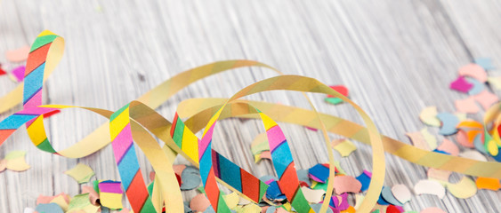 streamers on a white wooden background