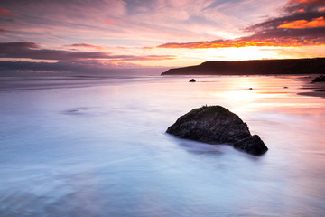 A calm beach in North Yorkshire at dawn