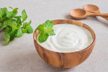 Yogurt in wooden bowl
