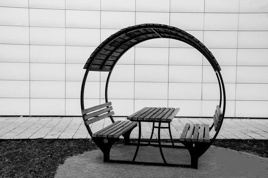 banches and the table in garden