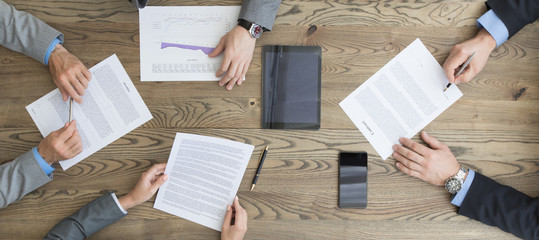 Business people discuss contract