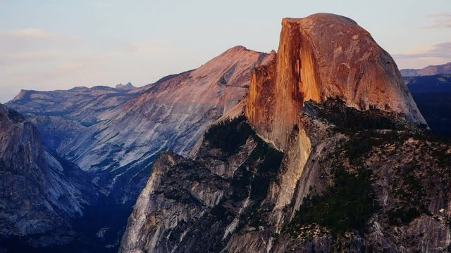 a zoom in shot of half dome in yosemite national park at sunset from glacier point recorded at 1080p 60fps