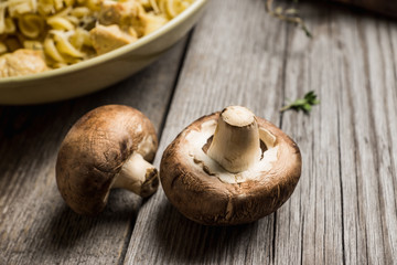 Fresh mushrooms on the rustic wooden background. Selective focus. Shallow depth of field.