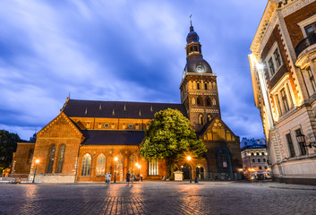 Riga, Latvia - August 22, 2017 : Beautiful evening view on Riga Cathedral (Dome Cathedral) with glowing lights, Riga, Latvia. The cathedral is one of the most recognizable landmarks in Latvia