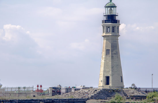 Exterior daytime stock photo of Buffalo Main Lighthouse at the mouth of the Buffalo River and Erie Canal taken from Erie Basin Marina in Buffalo New York Erie County