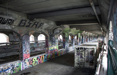 Exterior daytime stock photo of graffiti on walls of abandoned subway system in Rochester New York in Monroe County in Western New York