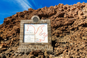 Teide National Park, Tenerife, Canary Islands - Tourist informational sign depicting the Montana Blanca hiking trail of the Teide volcano ascent, at 3718 m tall, it is the tallest peak in Spain
