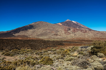 Fototapeta na wymiar Teide National Park, Tenerife, Canary Islands - A picturesque view of the colourful Teide volcano, or in spanish 'Pico del Teide'. The tallest peak in Spain with an elevation of 3718 m.