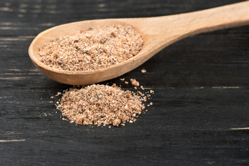 Nutmeg powder in spoon