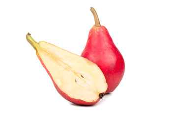 Ripe red pear with juicy half isolated on white background