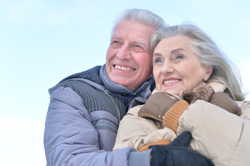 senior couple at winter outdoors