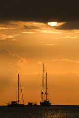 Fototapeta premium Silhouette of the boat sunset moment