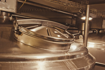 Brilliant cover of a large boiler for the food industry. Bronze color