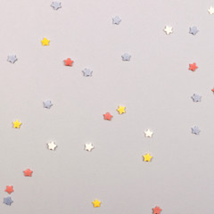 Paper flat composition with stars on the grey background for holiday. square