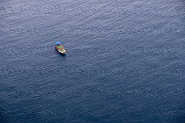 Boat on calm sea water near coast of Turkey