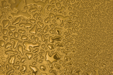 Gold liquid drops different abstract shapes in a large amount of
