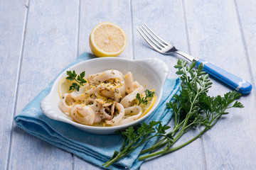 rings squid with parsley and grated lemon peel