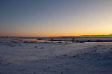 Golden House Sunset over a snowy winter landscape in Hella  Iceland