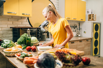 Female person cooking on the kitchen, organic food