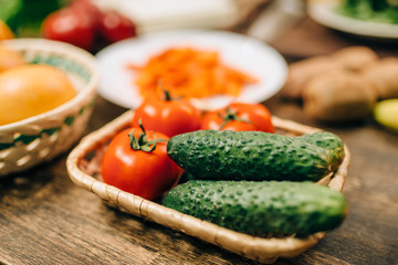 Raw vegetables on wooden table closeup, nobody