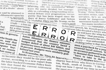 Fototapeta premium Error symbol catchword on newspaper