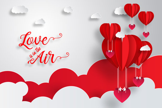 Love is in the air typography for valentines day with paper cut red heart shape balloon flying and hearts decorations in white background. Vector illustration.
