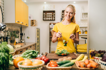 Woman cooking on the kitchen, eco food preparation