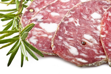 pork salami sliced on a white background
