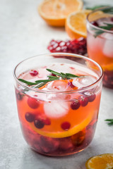 Refreshing cranberry citrus pomegranate cocktail. Selective focus, copy space. 