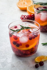 Winter cranberry citrus pomegranate drink. Selective focus, copy space. 