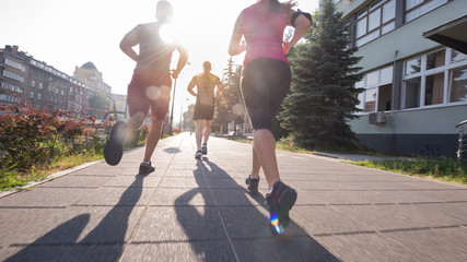 group of young people jogging in the city