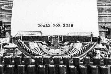 Old vintage typewriter with sample text Goals for 2018. on white paper