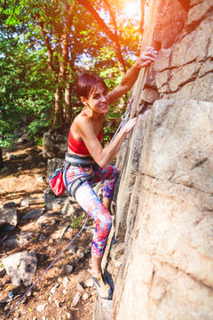 girl climber on a rock.