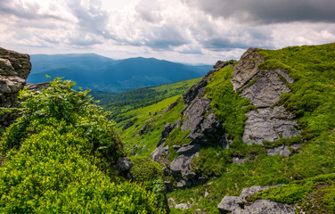 Fototapeta na wymiar rocky cliff on the hillside edge. spectacular view of mountainous landscape 