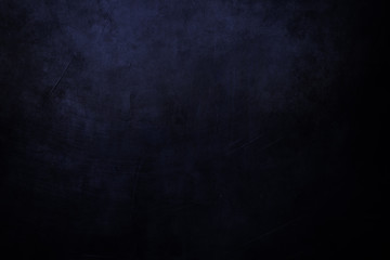 Obraz premium black and blue grungy background with spotlight background
