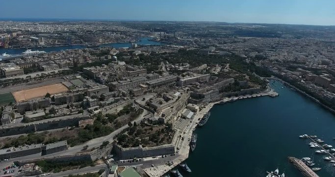 MALTA – AUGUST 2016 : Aerial shot of Valletta cityscape on a beauiful day with city walls and harbor in view