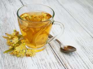 cup of herbal tea with linden flowers
