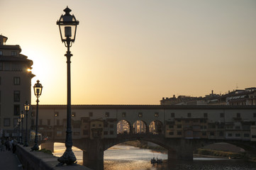 Ponte Vecchio over the Arno River at dusk in Florence, Italy
