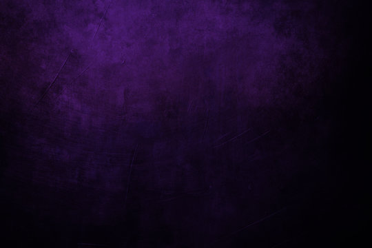 dark purple grungy background with spotlight background